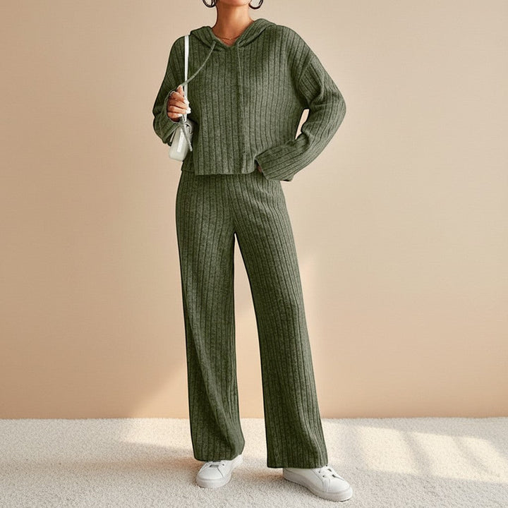 Comfortable women's ribbed two-piece set featuring a soft hoodie and relaxed straight-leg pants, perfect for travel.