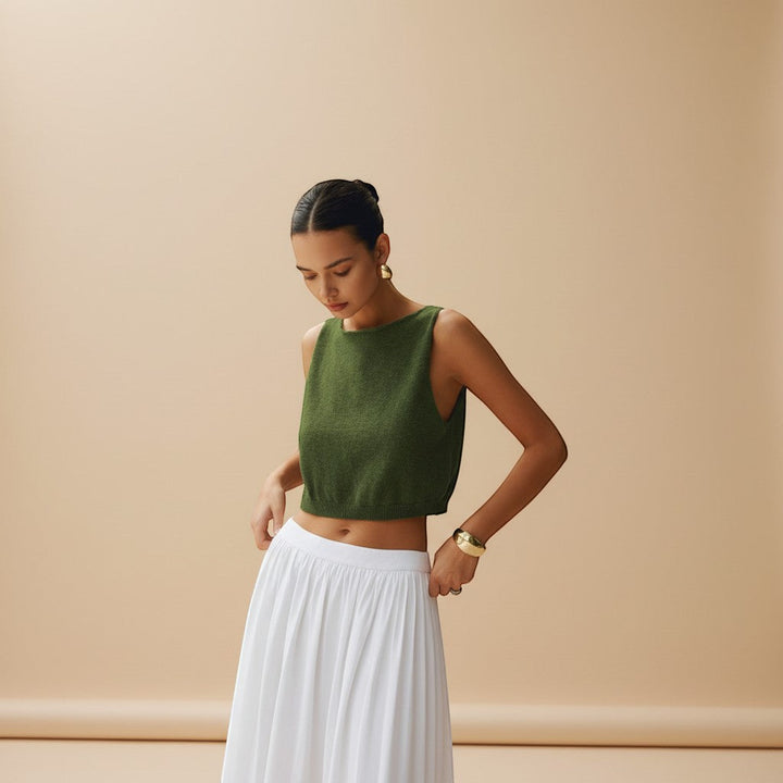 Chic women's crop top, sleeveless and high neck, suitable for modern summer fashion outfits.