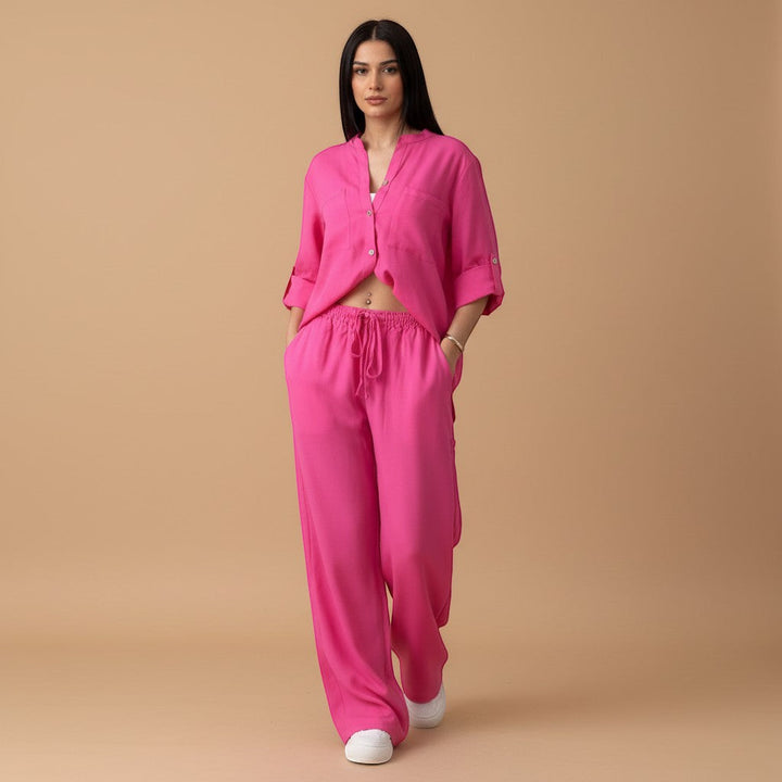 Women's comfortable travel outfit: relaxed button-down shirt & wide leg pants two-piece set.