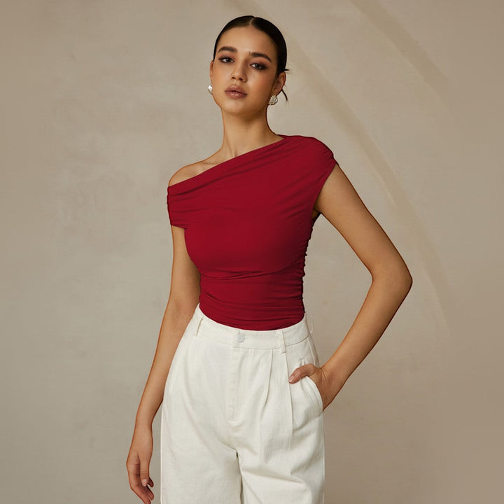 Women's asymmetrical one shoulder ruched top, a fitted and elegant choice for modern styling.