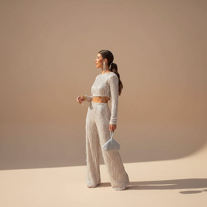 Women's sequin crop top & wide leg pants evening set, perfect for parties & special occasions. Glamorous sparkle.