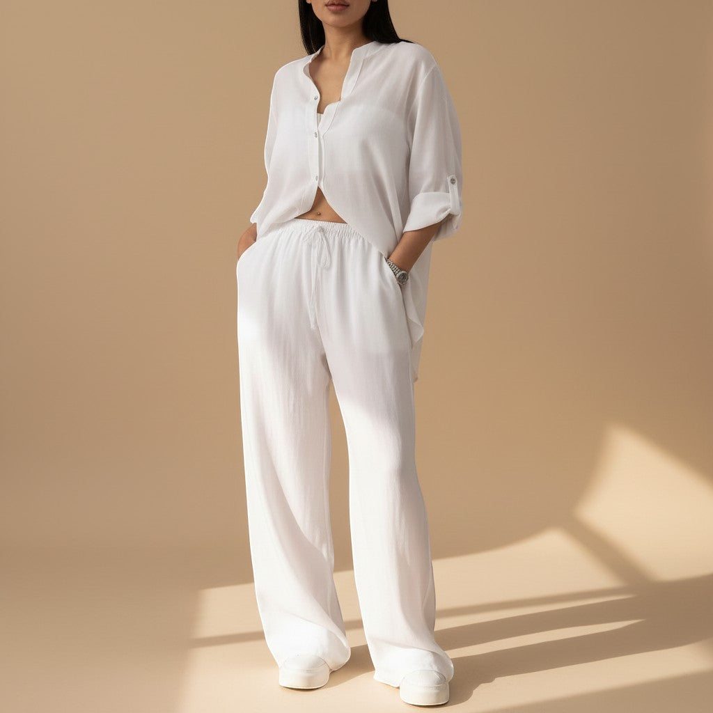 Women's relaxed fit button-down shirt & wide leg pants set. Comfortable two-piece lounge wear.