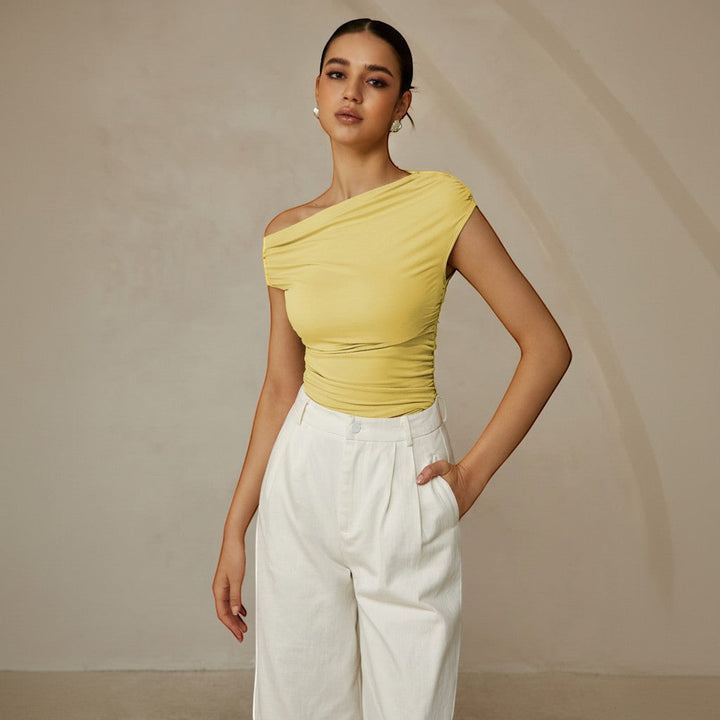 Sleek sleeveless women's top with asymmetrical one-shoulder and flattering ruched details.