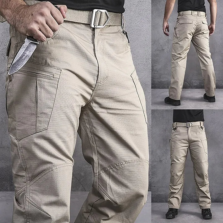 Close-up of men's multi-pocket tactical cargo pants, showing durable fabric and secure fastenings for outdoor adventure.