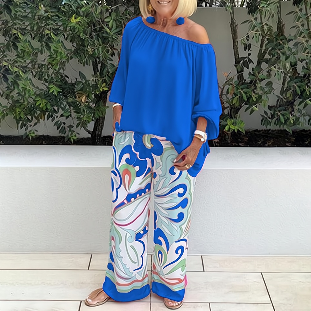 Stylish women's elegant wide-leg top & pants set. Two-piece coordinated outfit for comfortable summer fashion.
