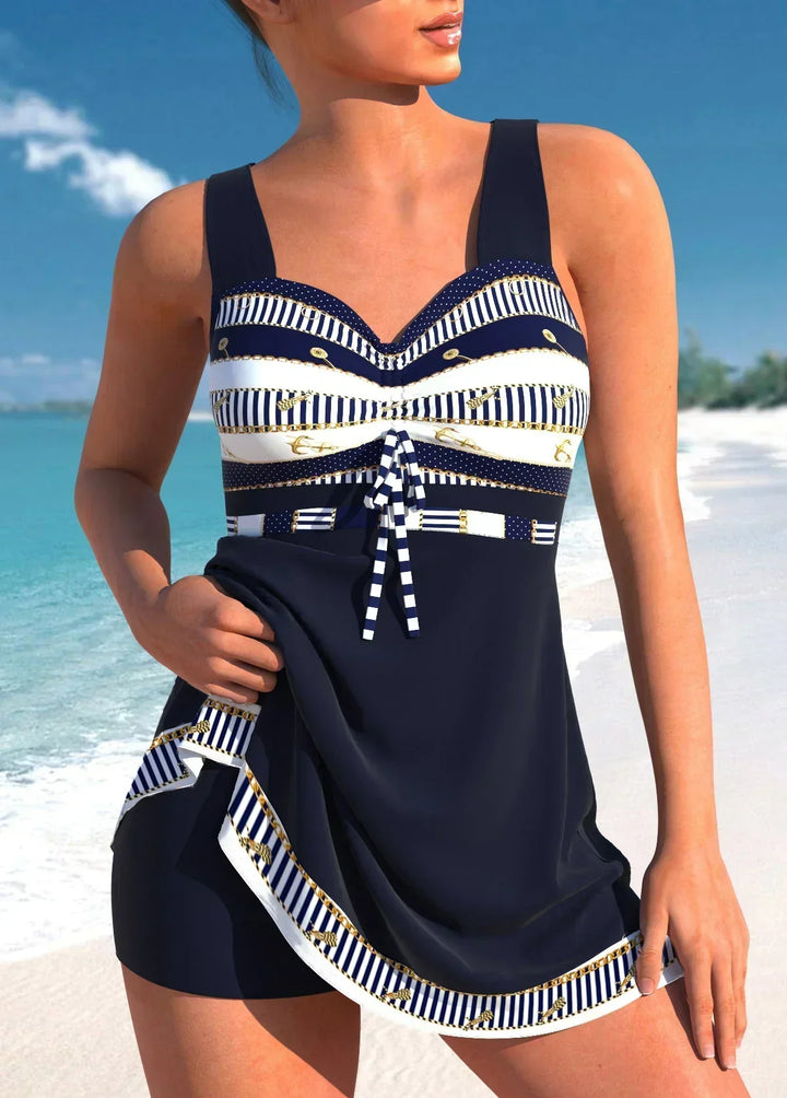 Stylish women's nautical stripe one-piece swimsuit, ideal beachwear for a chic vacation look by the pool.