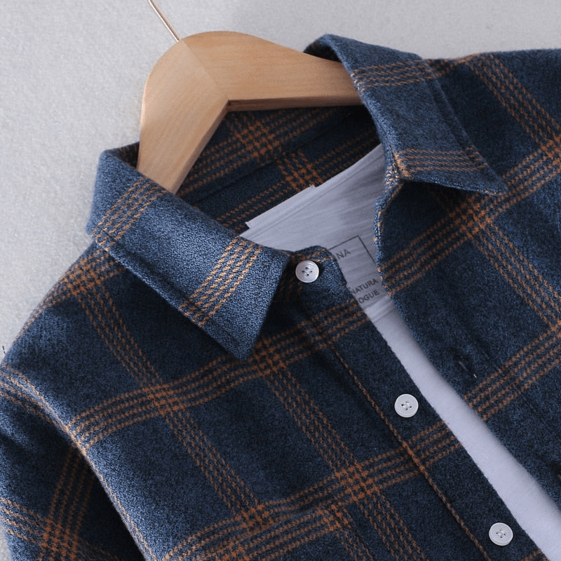 Casual men's long sleeve button-down shirt with a classic checkered pattern. Relaxed fit for versatile everyday style.