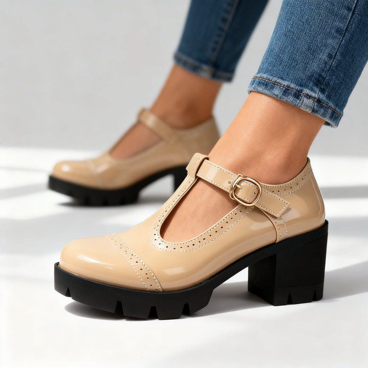 Timeless women's Mary Jane heels, T-bar strap design, comfortable block heel. Elegant footwear for dress occasions.