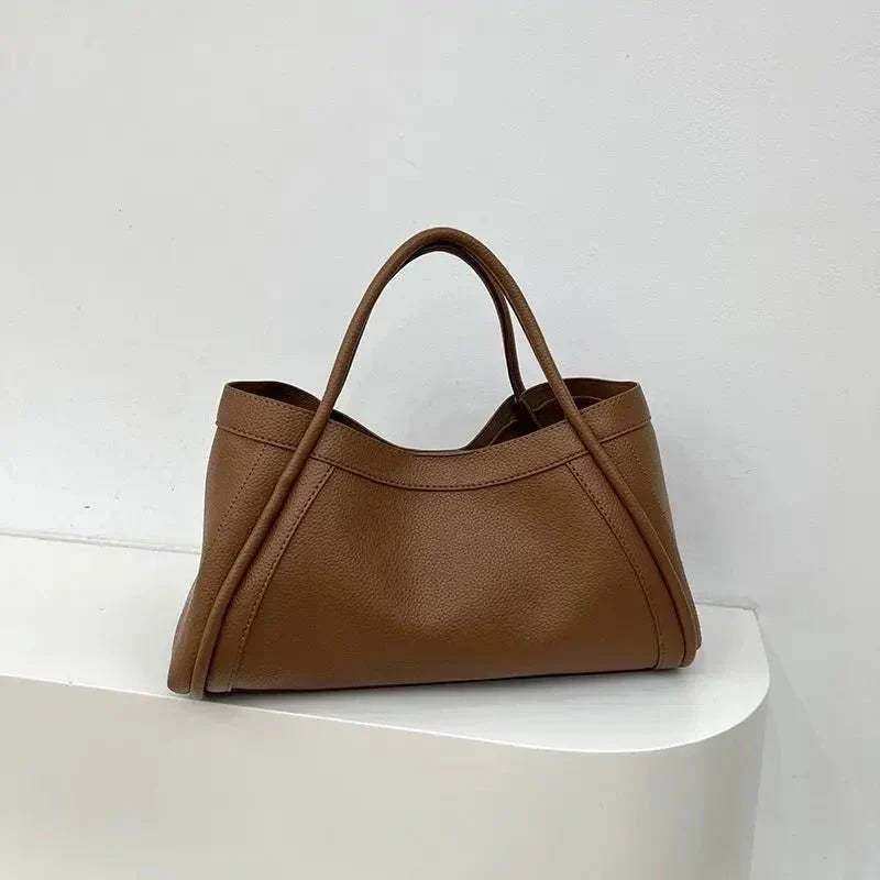 Chic women's structured everyday tote bag. Versatile carry for work, travel, and daily essentials, minimalist style.