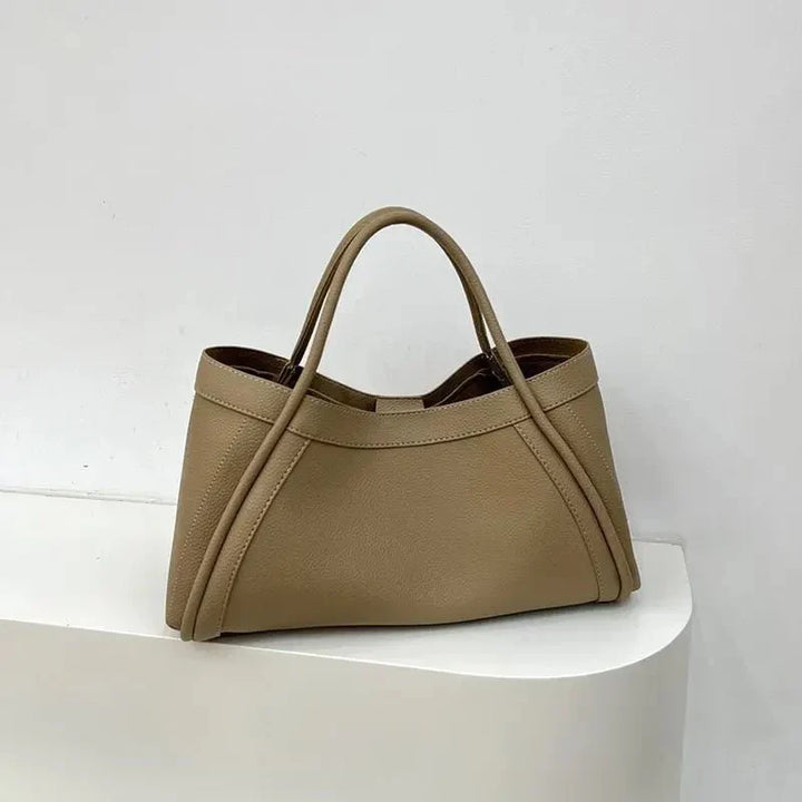 Fashionable women's travel tote bag. Structured shoulder bag, ideal travel companion & chic accessory for daily carry.
