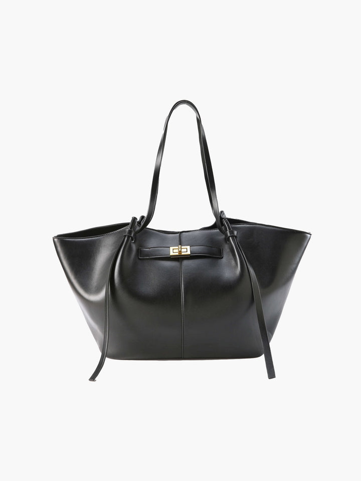 Elegant women's structured shopper bag with luxurious gold hardware, perfect for office or everyday fashion.