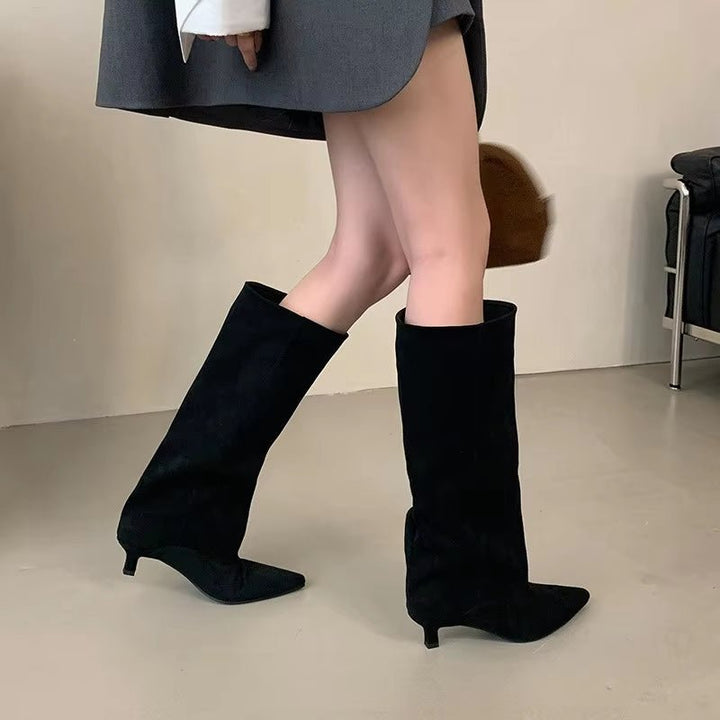 Elegant women's knee-high boots with a chic kitten heel and pointed toe, perfect for fall and winter fashion.
