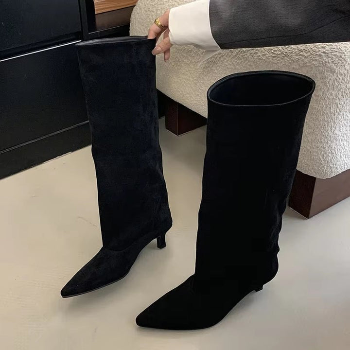 Sophisticated women's tall boots featuring a slender kitten heel and stylish pointed toe for a timeless look.
