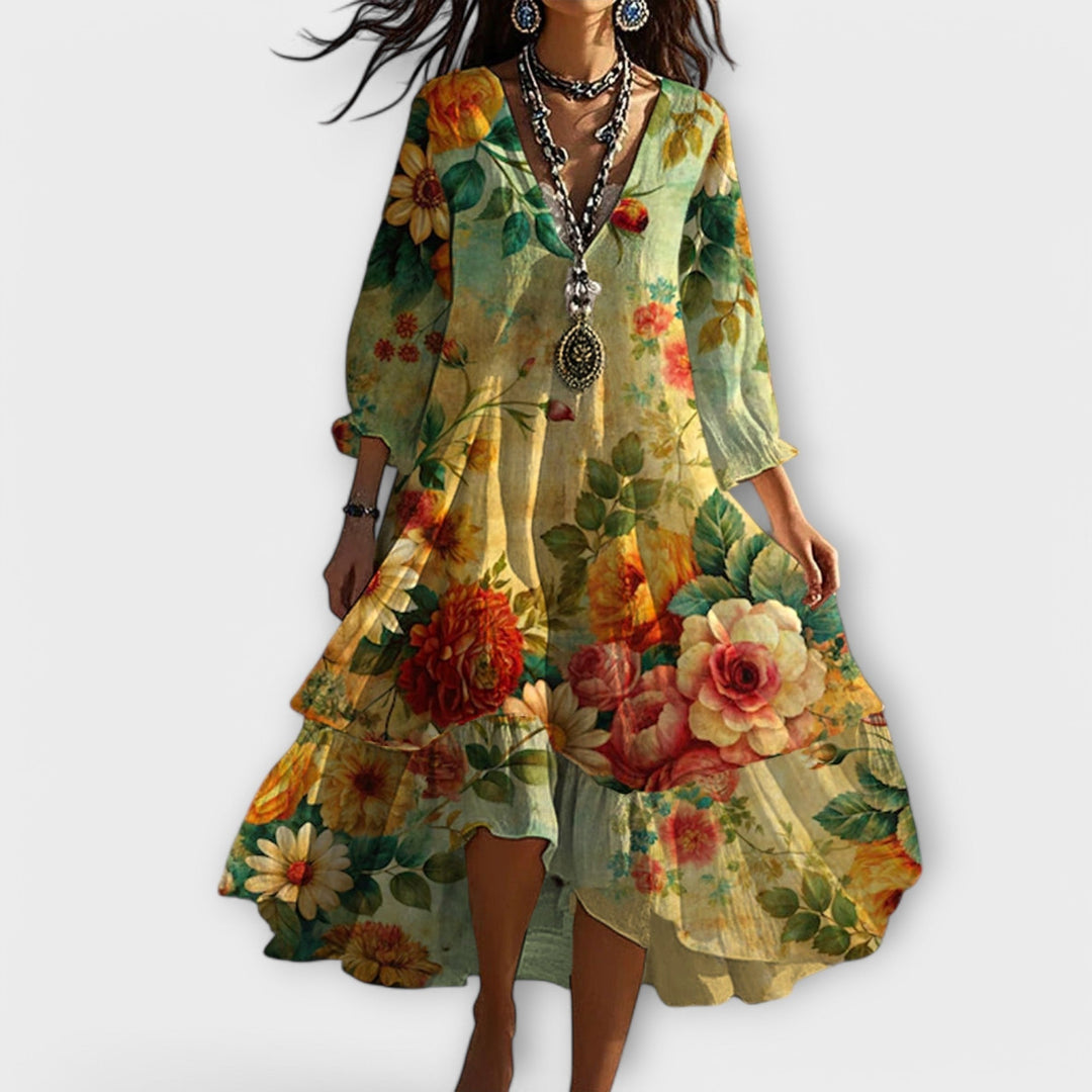 Tiered boho floral maxi dress for women, ideal as a summer wedding guest outfit. Comfortable and elegant.